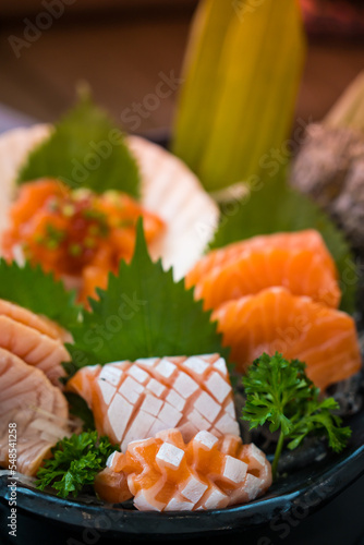A famous Japanese menu is salmon sashimi. Selective focus