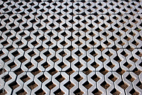 New permeable concrete block tiles as background photo
