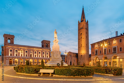 Forlí - The piazza Aurelio Saffi square with the his memorial and Basilica San Mercuriale at dusk.