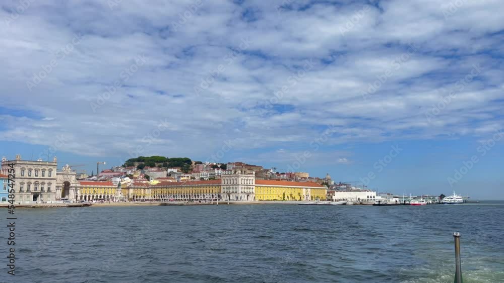 View from a moving ferryboat the city of Lisbon in Portugal View from a moving ferryboat the city of Lisbon in Portugal
