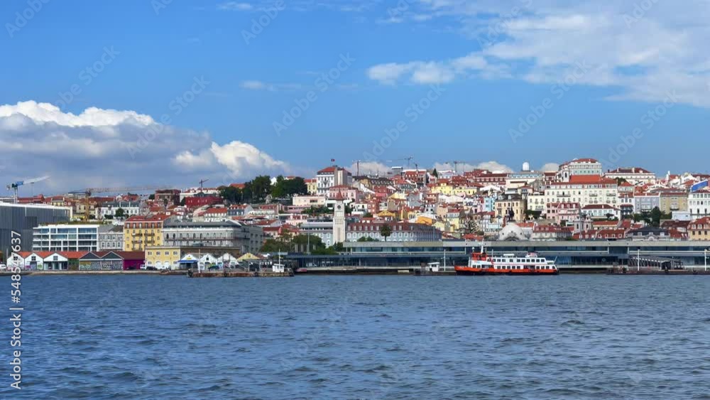 View from a moving ferryboat the city of Lisbon in Portugal View from a moving ferryboat the city of Lisbon in Portugal