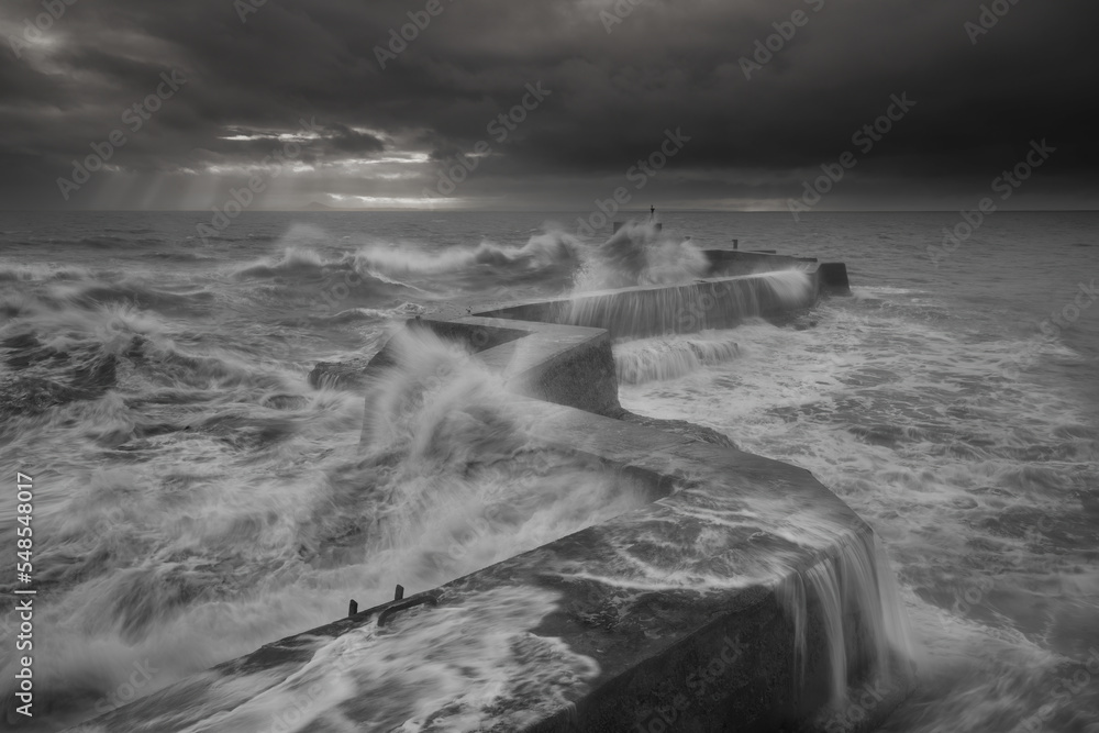 Dramatic coastal water conditions at the Break water pier also known as the zig zag pier located at St Monans, Fife, Scotland UK.
