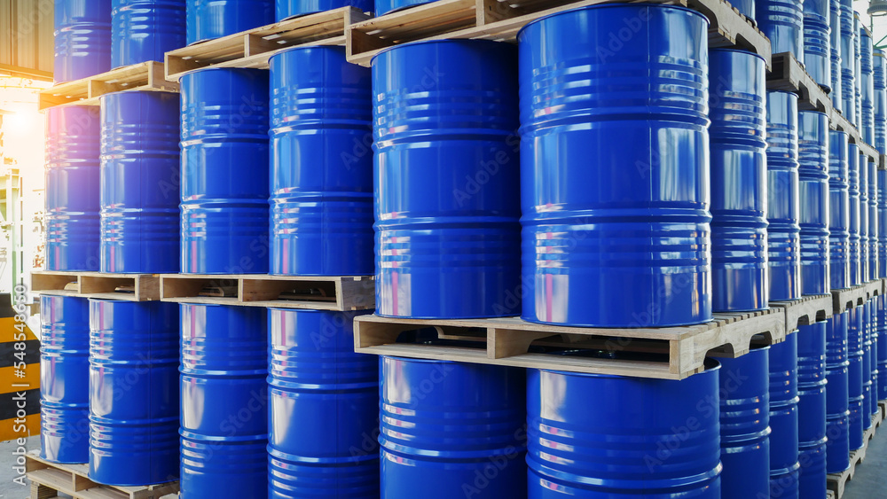 Blue barrel drum on the pallets contain liquid chemical in warehouse prepare for delivery to customer by made to order. Manufacture of chemicals production. Oil and chemical industrial works concept Blue barrel drum on the pallets contain liquid chemical in warehouse prepare for delivery to customer by made to order. Manufacture of chemicals production. Oil and chemical industrial works concept