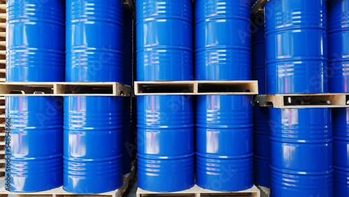 Blue barrel drum on the pallets contain liquid chemical in warehouse prepare for delivery to customer by made to order. Manufacture of chemicals production. Oil and chemical industrial works concept