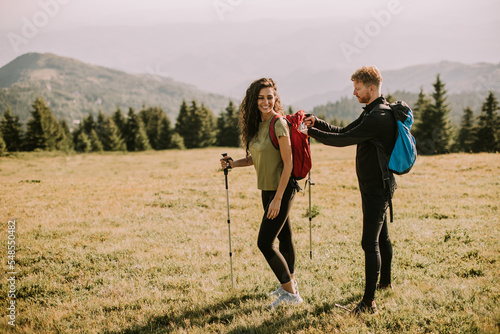 Smiling couple preparing hi...