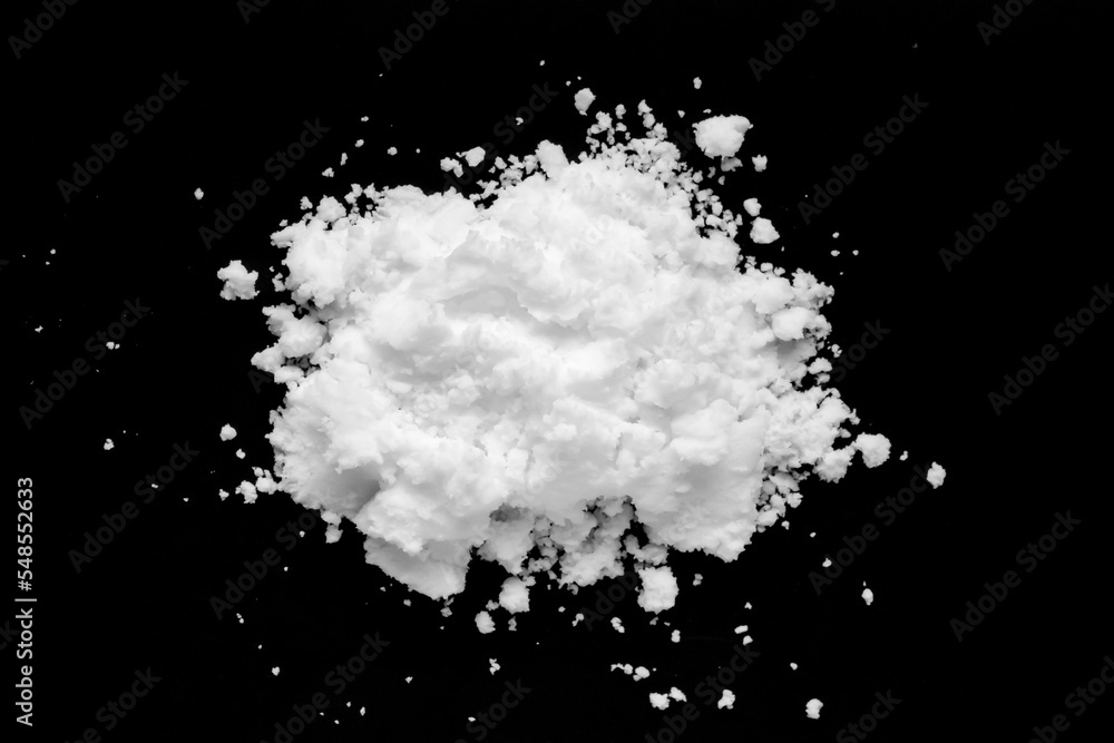 White snow isolated on black background close up White snow isolated on black background close up