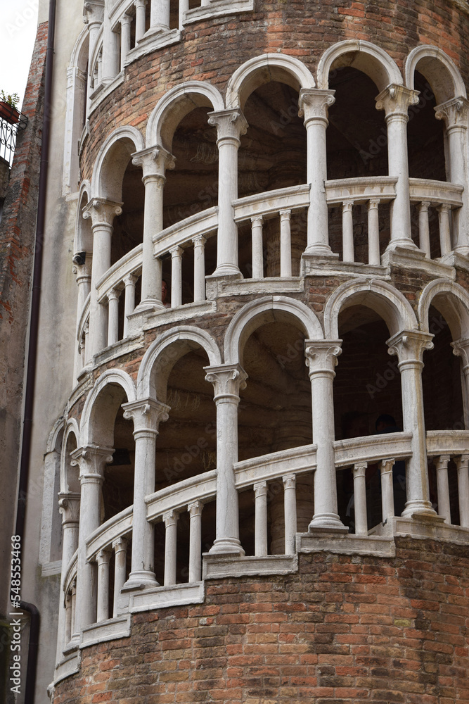 Closeup of the white columns of Scala Contarini del Bovolo in Venice Italy