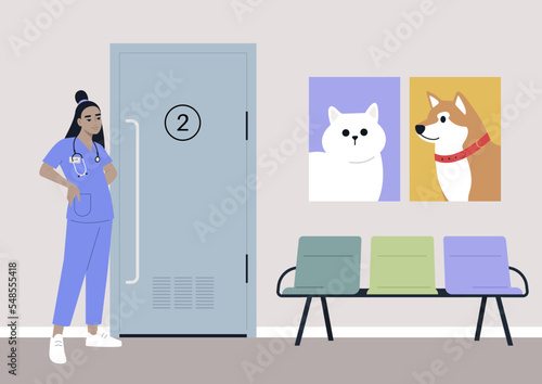 A young female Asian veterinary doctor waiting for visitors in the lobby, domestic animals health care
