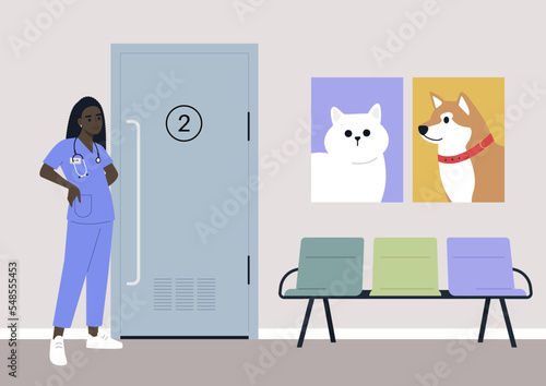 A young female African veterinary doctor waiting for visitors in the lobby, domestic animals health care