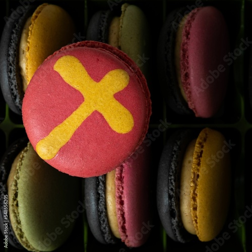 Colorful French macarons with cross design - Holiday sweets