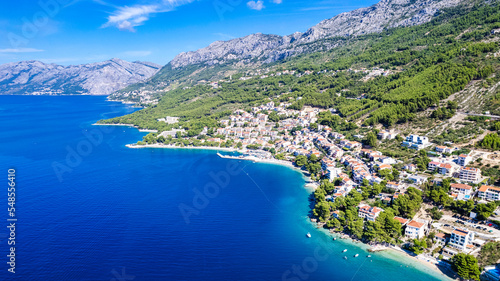 Beautiful Punta Rata beach in Brela, Croatia, aerial view. Adriatic Sea with amazing turquoise clean water and white sand on the beach.
