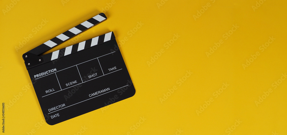 clapper board or movie slate on yellow background.