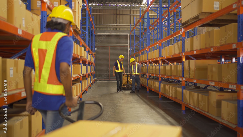 Portrait of Asian worker working in large warehouse retail store industry. Rack of stock storage. Interior of cargo in ecommerce and logistic concept. Depot. People lifestyle. Shipment service. Portrait of Asian worker working in large warehouse retail store industry. Rack of stock storage. Interior of cargo in ecommerce and logistic concept. Depot. People lifestyle. Shipment service.