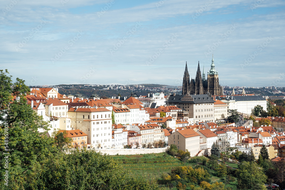Prague, Czech Republic, a fairy tale with orange-roofed houses and Prague Castle in harmony with nature
