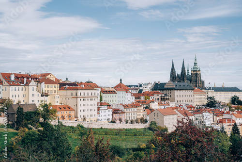 Prague, Czech Republic, a fairy tale with orange-roofed houses and Prague Castle in harmony with nature