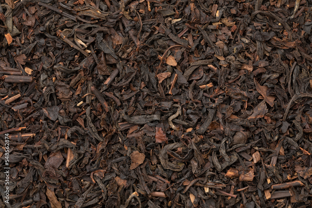 Formosa Oolong dried tea leaves close up full frame as background Formosa Oolong dried tea leaves close up full frame as background
