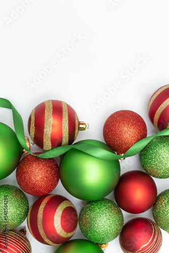 Elegant Christmas flatlay mockup composition with red and green balls and ribbon