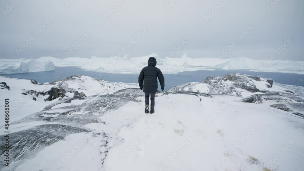 Wide Shot Of A Man Reaching The Top Of A Snowy Mountain Wide Shot Of A Man Reaching The Top Of A Snowy Mountain