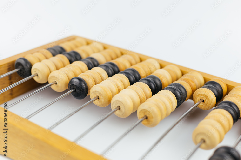 Old wooden abacus on a white background. Antique calculator. Old wooden abacus on a white background. Antique calculator.