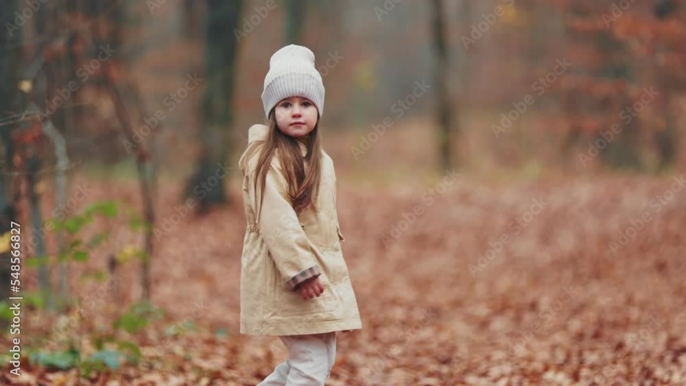 little girl running through the autumn forest little girl running through the autumn forest