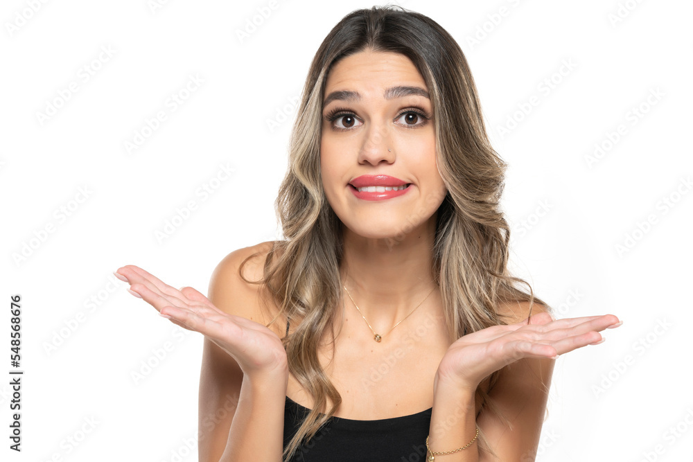 Close up portrait of young womanwearing black T-shirt, feeling guilty, confused, making helpless gesture with hands, having Oops expression on her face. Close up portrait of young womanwearing black T-shirt, feeling guilty, confused, making helpless gesture with hands, having Oops expression on her face.