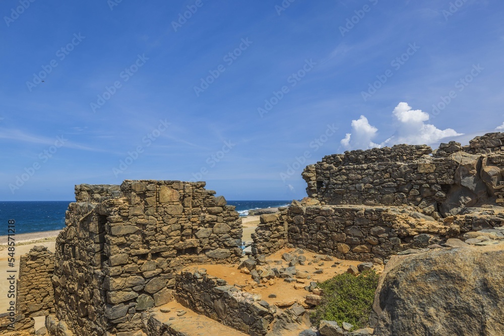 Beautiful view from Bushiribana ruins high at blue water of Atlantic Ocean. Aruba.