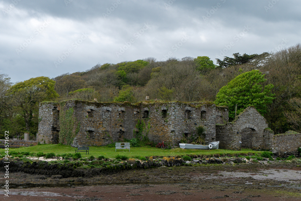 The Arundel grain store, shore of Clonakilty Bay. An stone building. Historical monument, landscape. Tourist attractions in Ireland