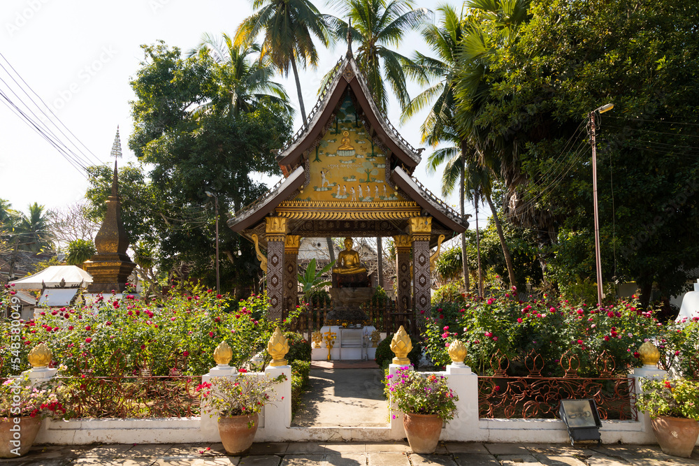 Seated golden Buddha statue in one of the pagodas of the Wat Xieng Thong temple in Luang Prabang, Laos Seated golden Buddha statue in one of the pagodas of the Wat Xieng Thong temple in Luang Prabang, Laos