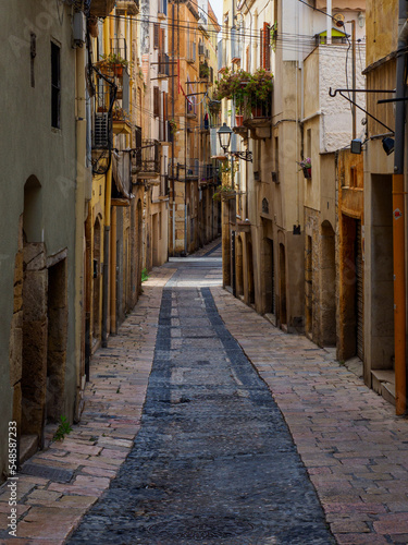 narrow and colorful alley in the historical center of a Mediterranean city, in Tarragona, Spain.