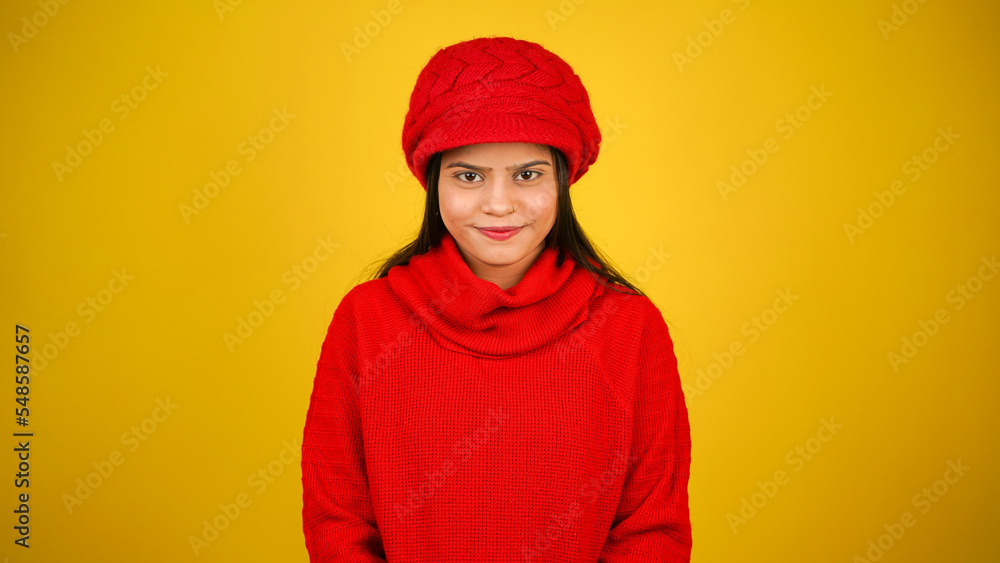 Young woman wearing winter clothes isolated over colour background, Beautiful girl wearing sweater Young woman wearing winter clothes isolated over colour background, Beautiful girl wearing sweater