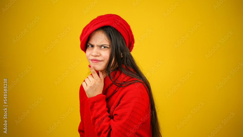 Young woman wearing winter clothes isolated over colour background, Beautiful girl wearing sweater Young woman wearing winter clothes isolated over colour background, Beautiful girl wearing sweater