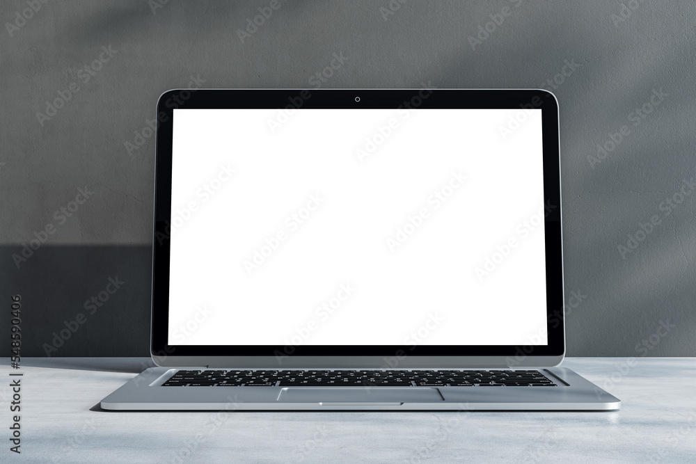 Front view on blank white laptop monitor with place for your logo or text on light grey concrete surface and sunlit wall background. 3D rendering, mockup Front view on blank white laptop monitor with place for your logo or text on light grey concrete surface and sunlit wall background. 3D rendering, mockup