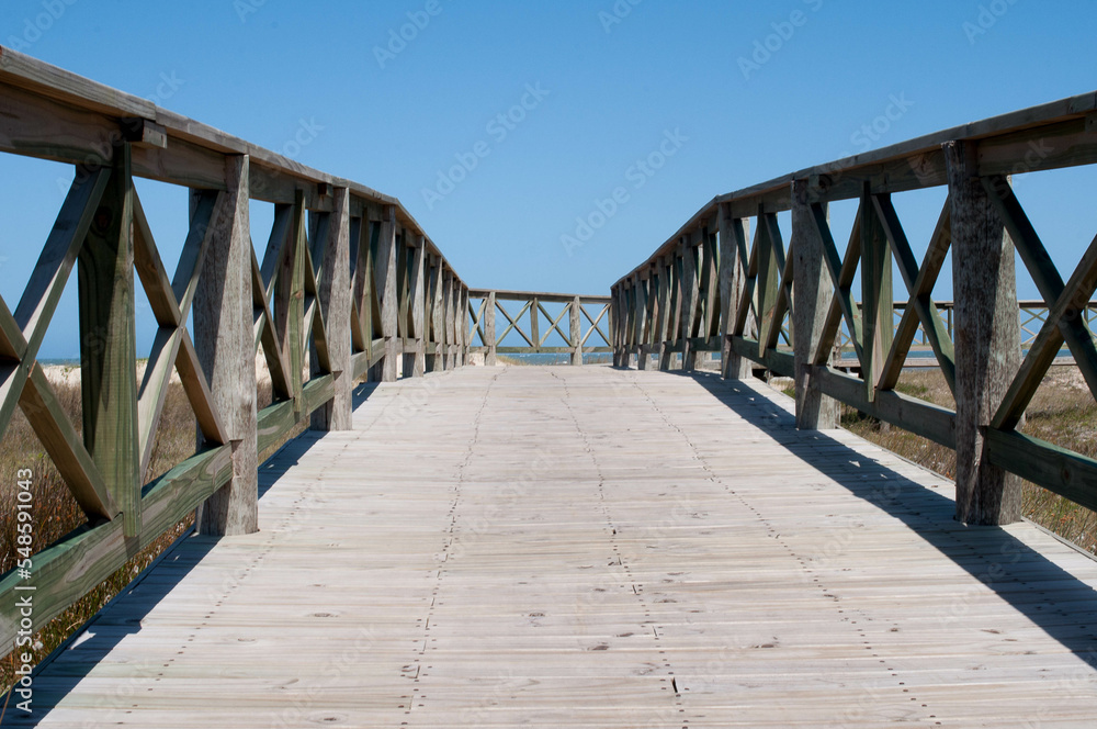 Photograph of a deck on the beach
