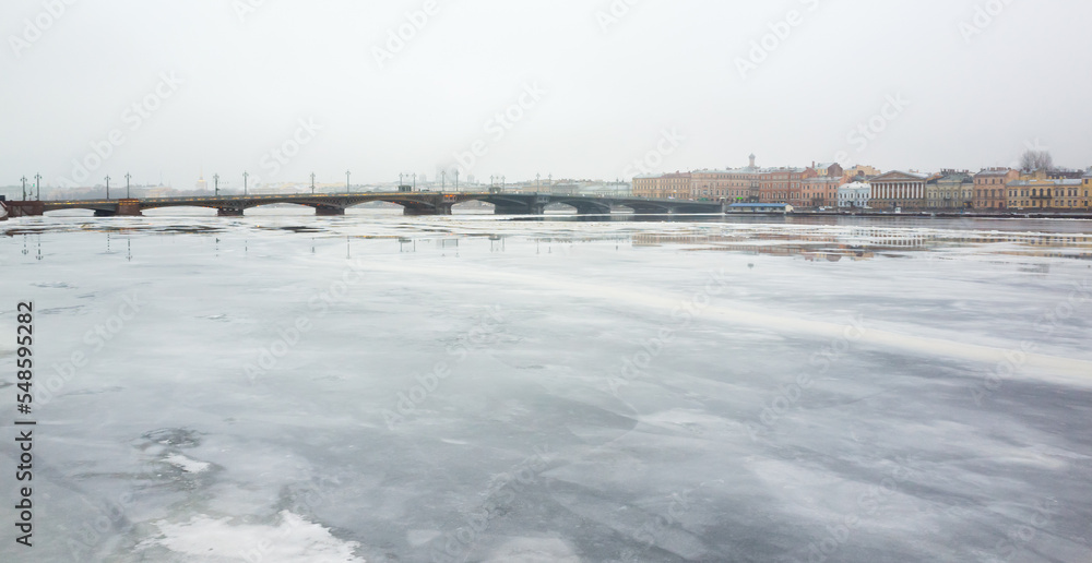 Saint-Petersburg, Russia. Winter cityscape with frozen Neva river Saint-Petersburg, Russia. Winter cityscape with frozen Neva river