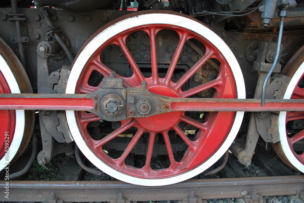 red wheel of an old steam locomotive