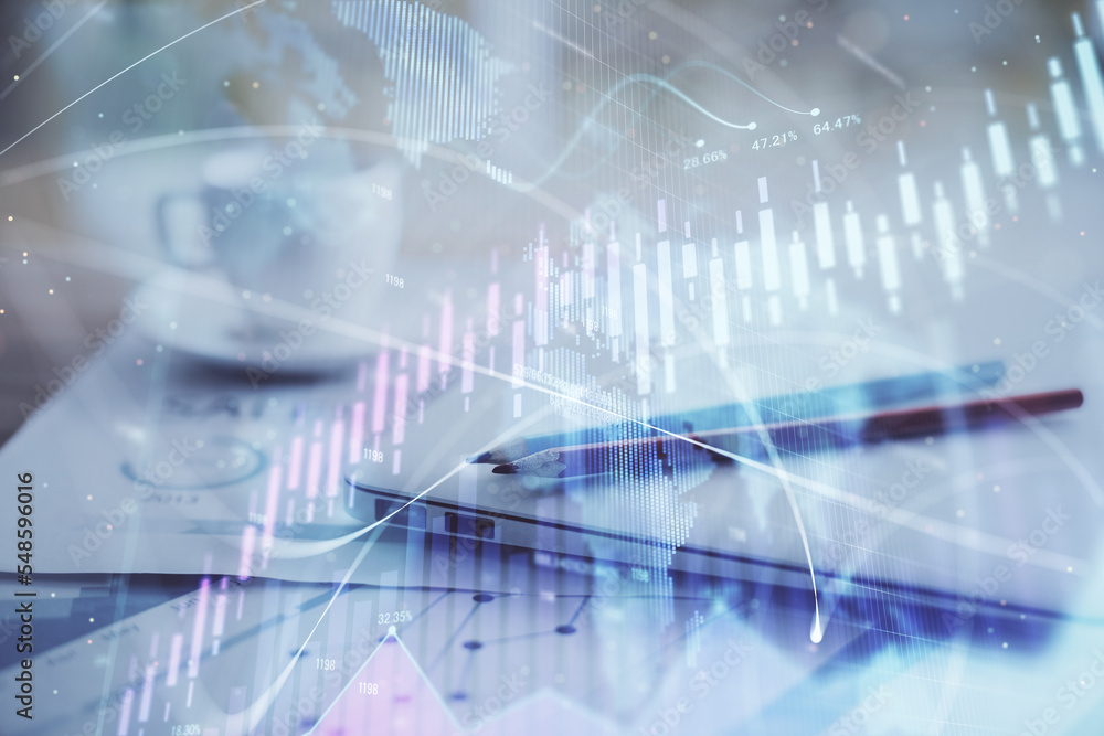 Forex graph hologram on table with computer background. Double exposure. Concept of financial markets. Forex graph hologram on table with computer background. Double exposure. Concept of financial markets.