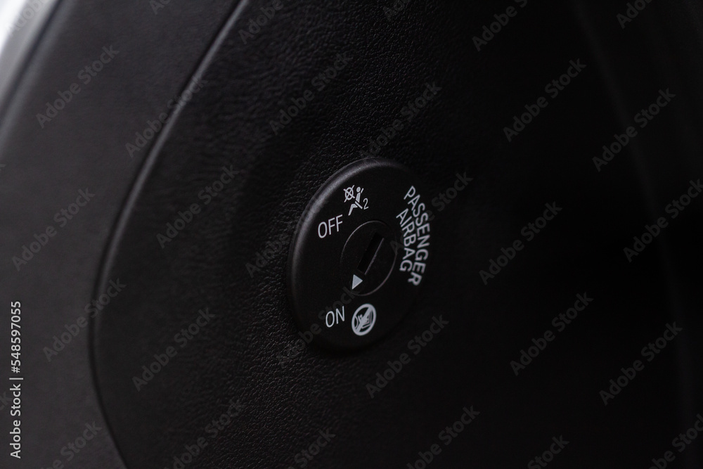 Front passenger airbag on and off switch close up view. Passenger
