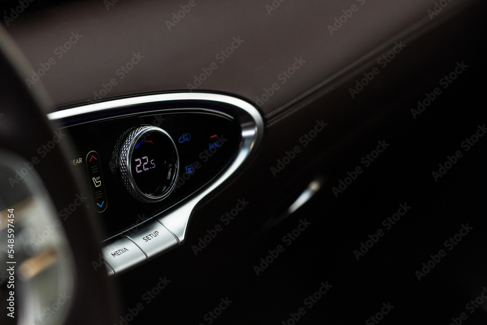 Digital control panel car air conditioner dashboard. Modern car interior conditioning buttons inside a car close up view. Digital control panel car air conditioner dashboard. Modern car interior conditioning buttons inside a car close up view.