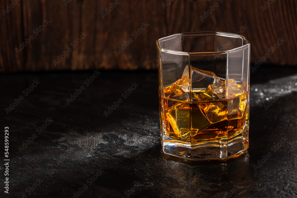 Whiskey with Ice on a Wooden Table