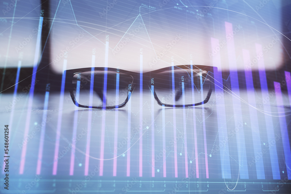 Financial graph hologram with glasses on the table background. Concept of business. Double exposure. Financial graph hologram with glasses on the table background. Concept of business. Double exposure.
