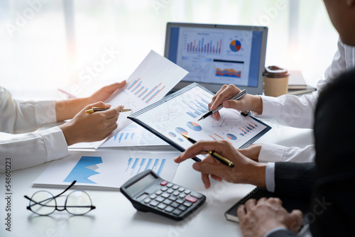 business people meeting in the office Calculate the tax and income of the company's investment. Strategic Planning and Brainstorming colleague concept, report, analyze graph plans