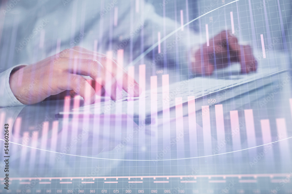 Double exposure of graph with man typing on computer in office on background. Concept of hard work. Closeup. Double exposure of graph with man typing on computer in office on background. Concept of hard work. Closeup.