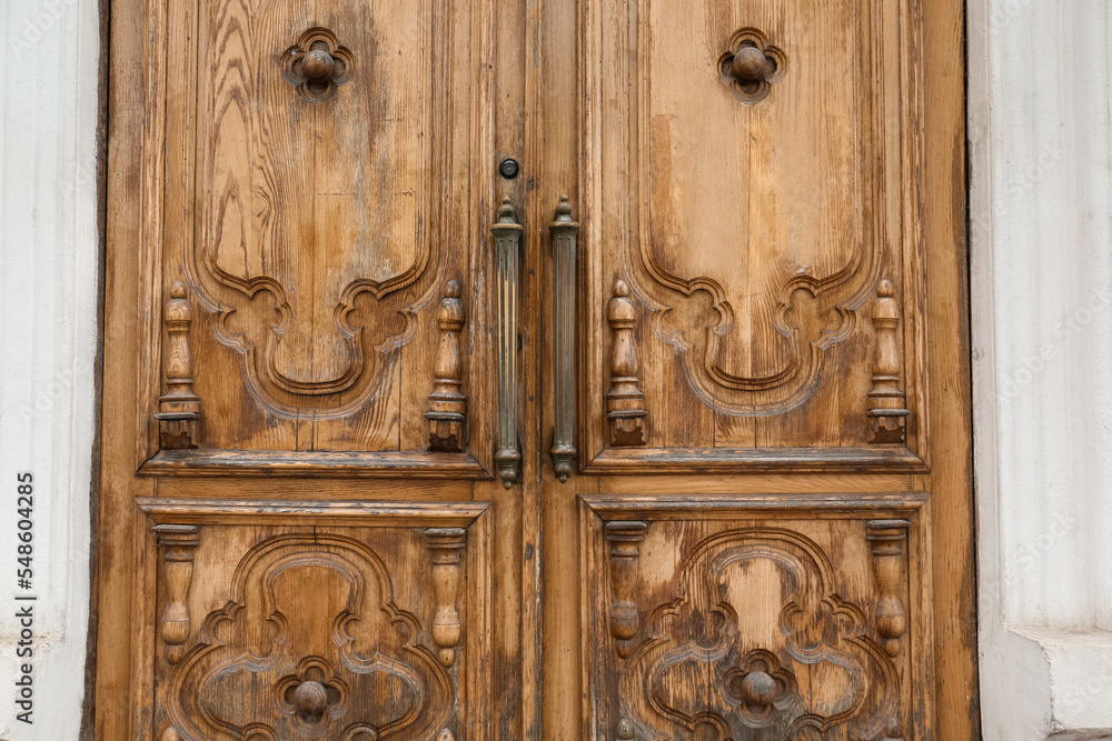 Building with old wooden door, closeup Building with old wooden door, closeup
