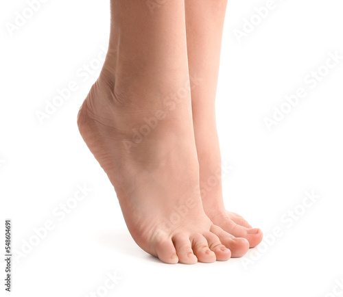 Female bare feet on white background