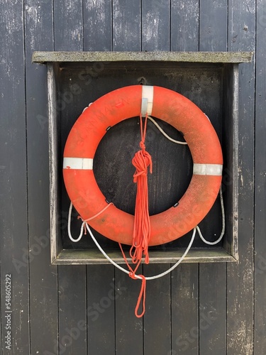 orange life buoy on the wall