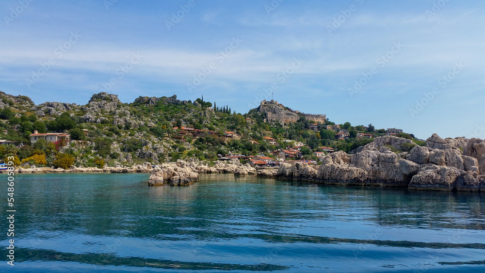 view of the ancient cliffs from the sea. Sea and beach view on a summer day. Kekova, Antalya, Turkey