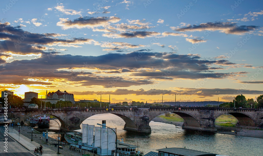 Beautiful Dresden city skyline at Elbe river and Augustus Bridge at sunset , Dresden, Saxony, Germany. a view of the dresden at sunset. Medieval bridges at sunset