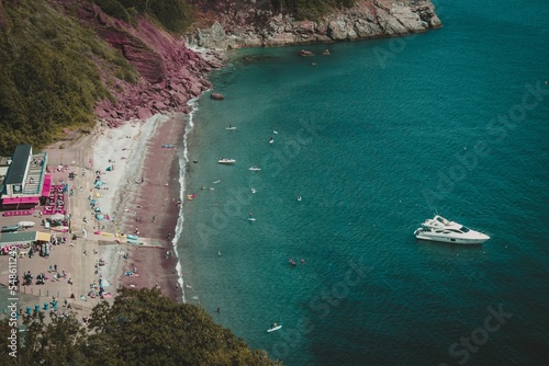 Aerial view of the coast and the boat in the sea in Babbacombe, Torquay, Devon UK photo