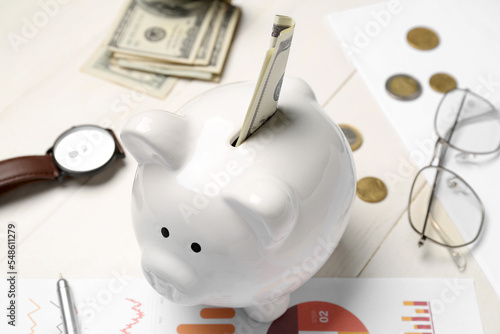 Piggy bank with money on wh...