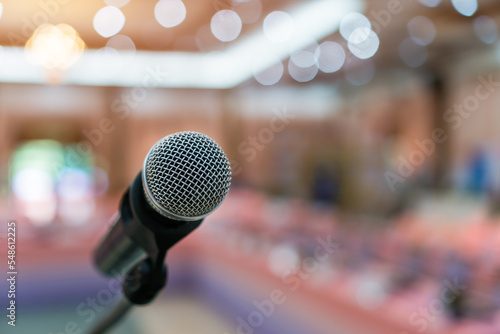 Public Microphone for speech speaking in seminar hall on blure backgrounds, Close-up microphones on stand for speaker teaching room with Event light convention hall for Business meeting education